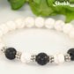 Close up of White Howlite and Black Lava Stone Bracelet.