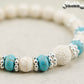 Close up of White Howlite and Lava Stone Bracelet.