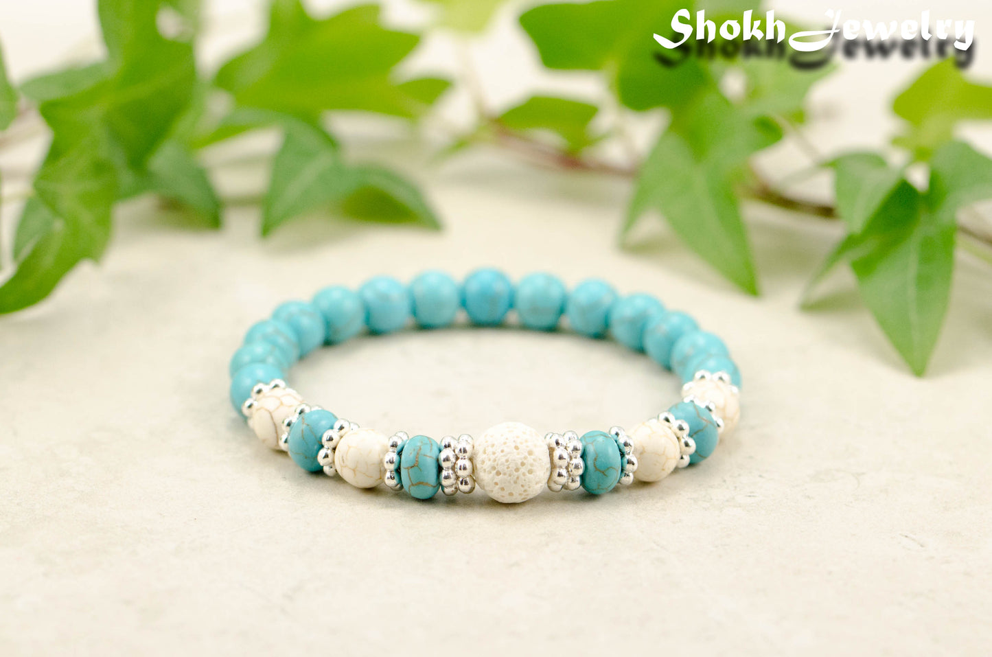 Turquoise Howlite and Lava Stone Bracelet with white howlite accent beads.