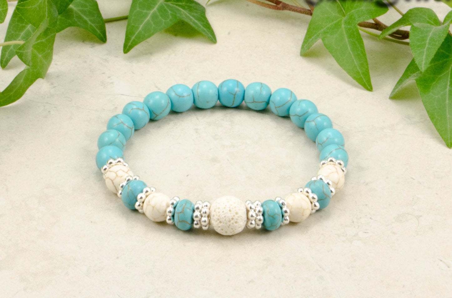 Turquoise Howlite and Lava Stone Bracelet with white howlite accent beads.