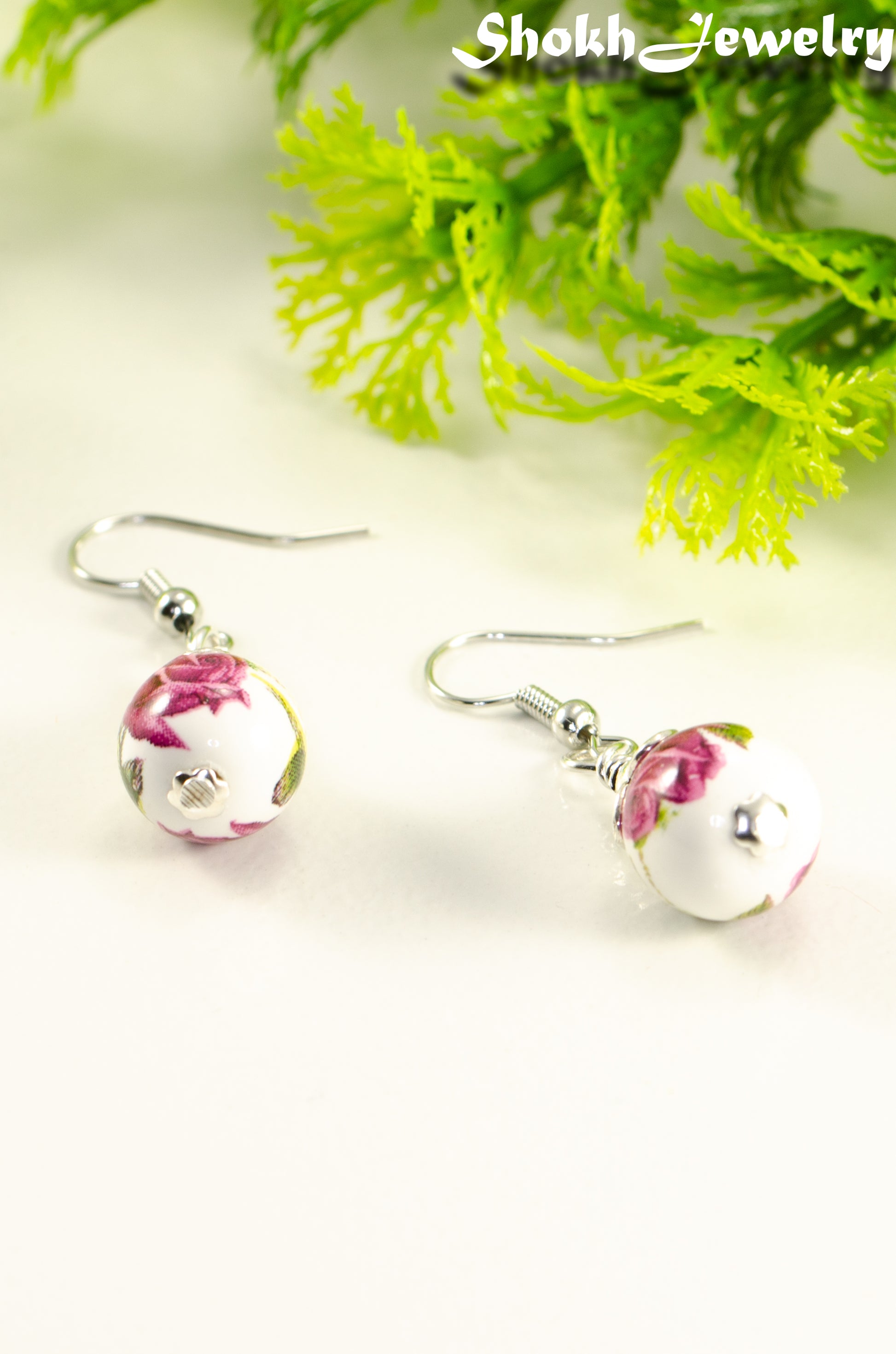 Side view of 12mm Ceramic Pink Flower Earrings.