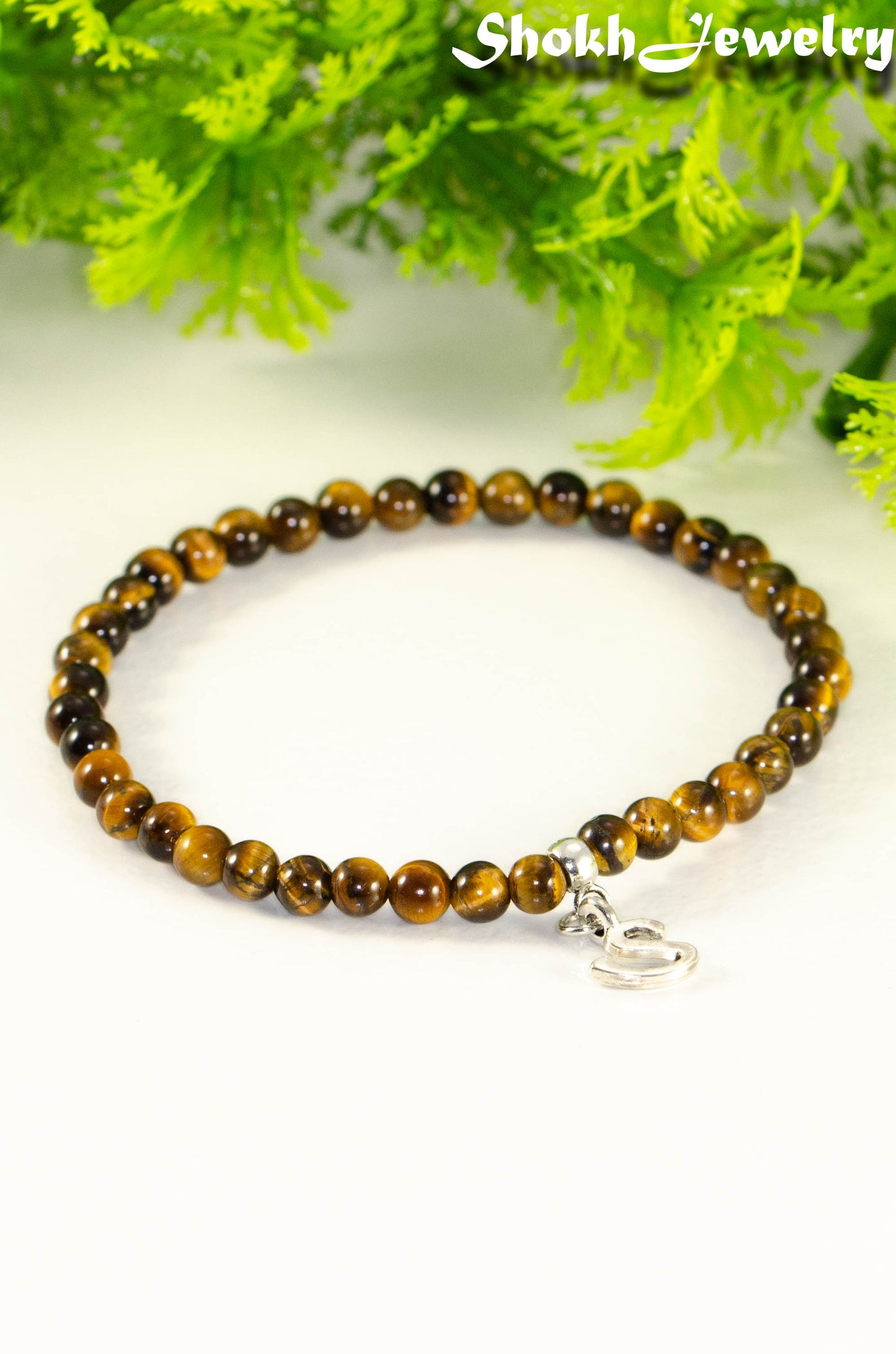 Close up of 4mm Tiger's Eye Bracelet with Initial.