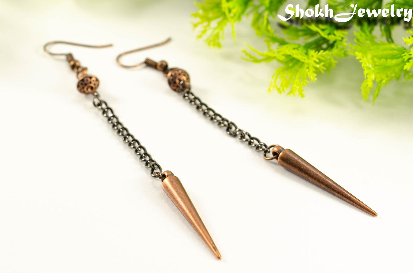 Close up of Statement chain and antique copper spike earrings