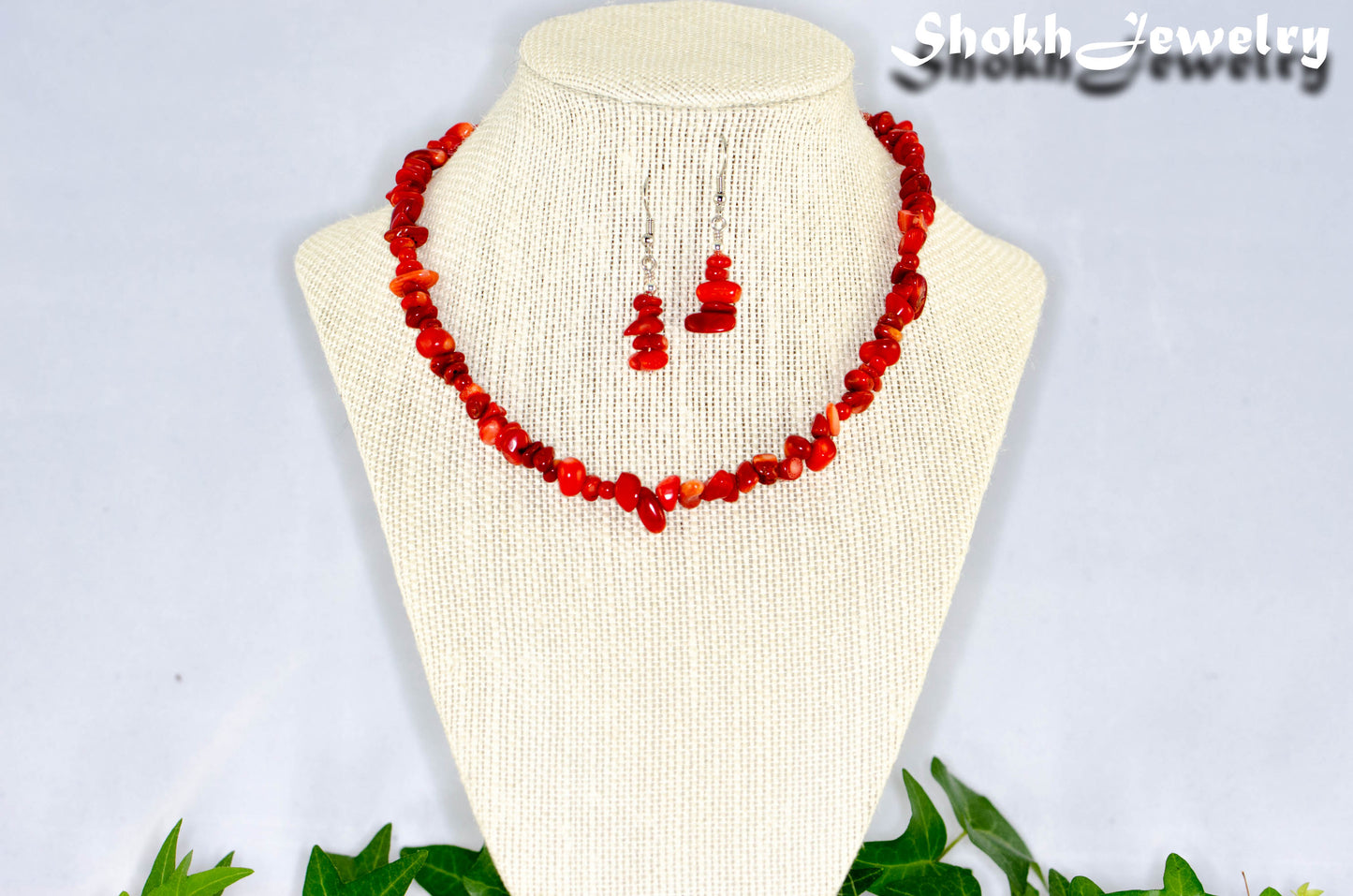 Natural Red Coral Chip Choker Necklace and Earrings Set displayed on a bust