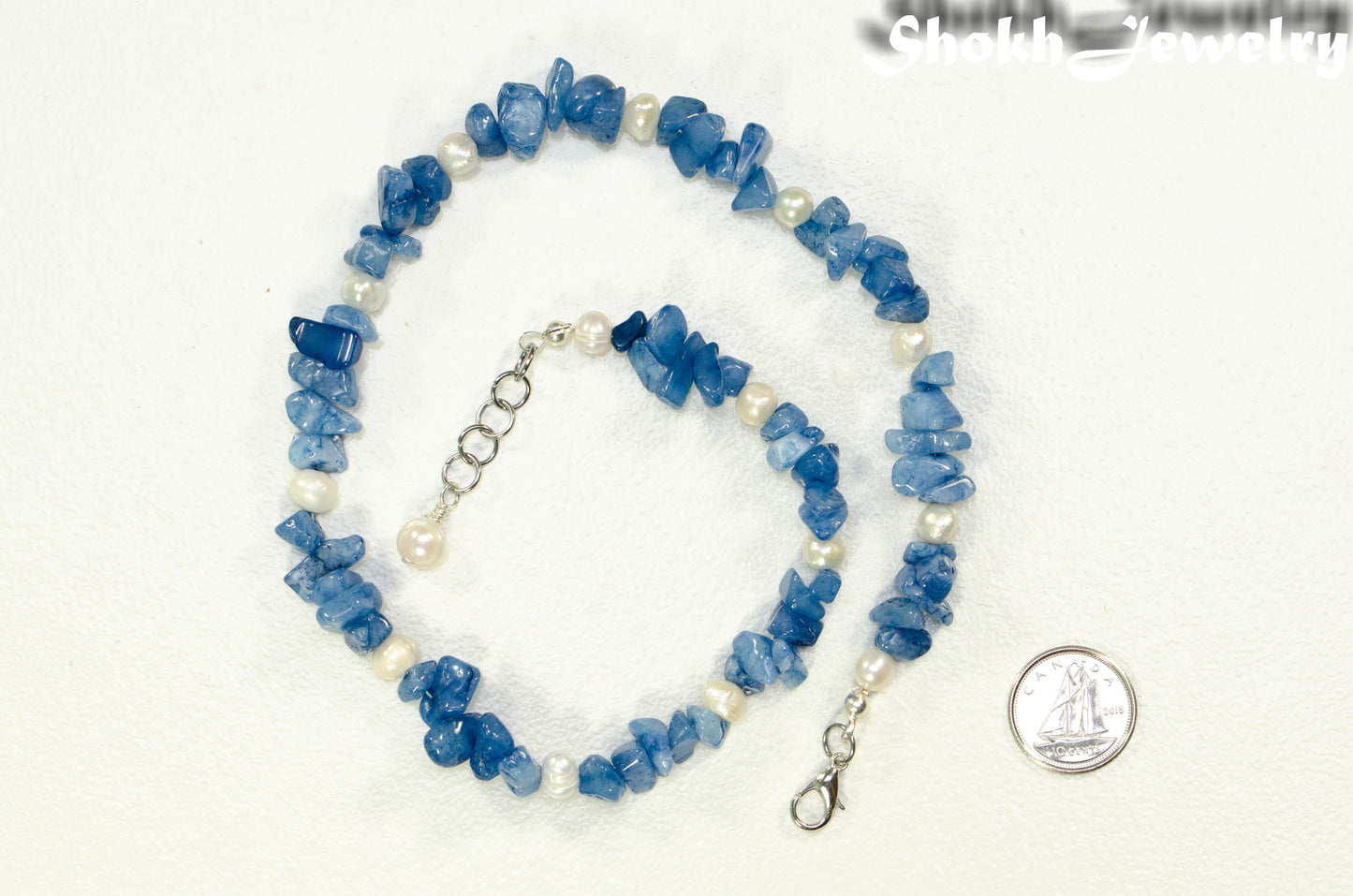 Natural Blue Quartzite Crystal Chip and Pearl Anklet beside a dime.