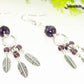 Close up of Statement Amethyst Crystal And Feather Earrings.
