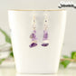 Natural Amethyst Crystal Chip Earrings on a tea cup