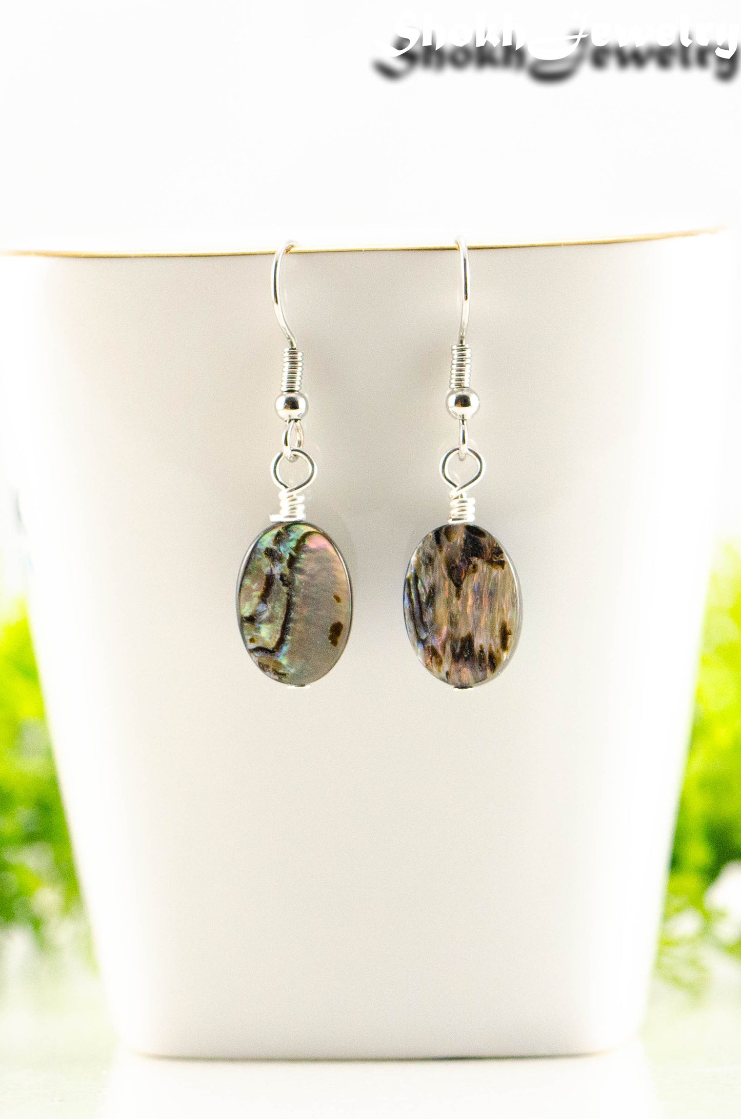 Close up of Simple Oval Abalone Shell Earrings.