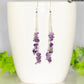 Long Silver Plated Chain and Amethyst Crystal Chip Earrings on a mug