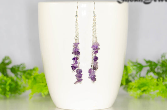 Long Silver Plated Chain and Amethyst Crystal Chip Earrings on a mug