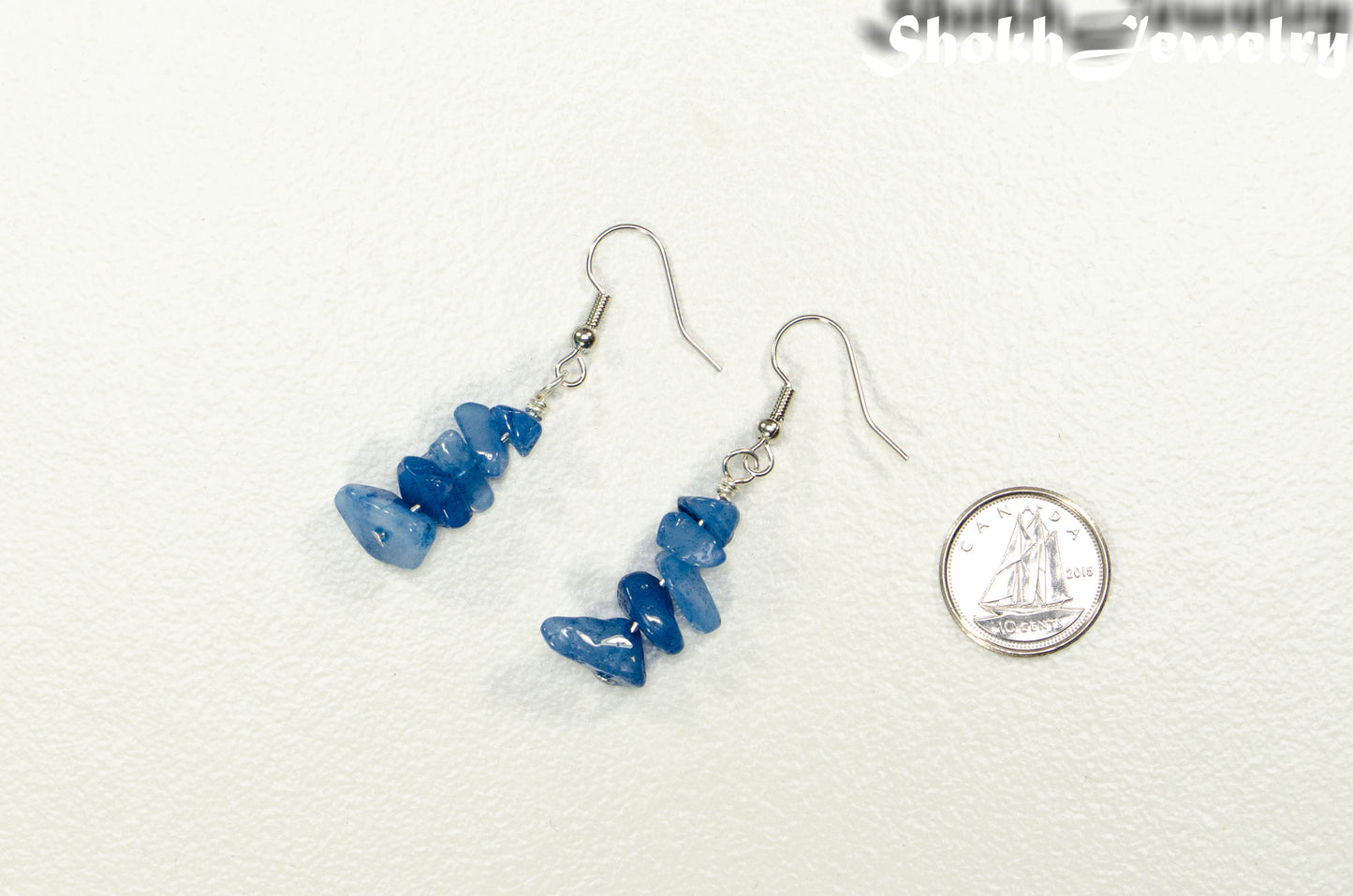 Simple Blue Quartzite Crystal Chip Earrings beside a dime.