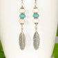Close up of Statement White And Turquoise Howlite And Feather Earrings.