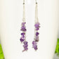 Long Silver Plated Chain and Amethyst Crystal Chip Earrings on a mug