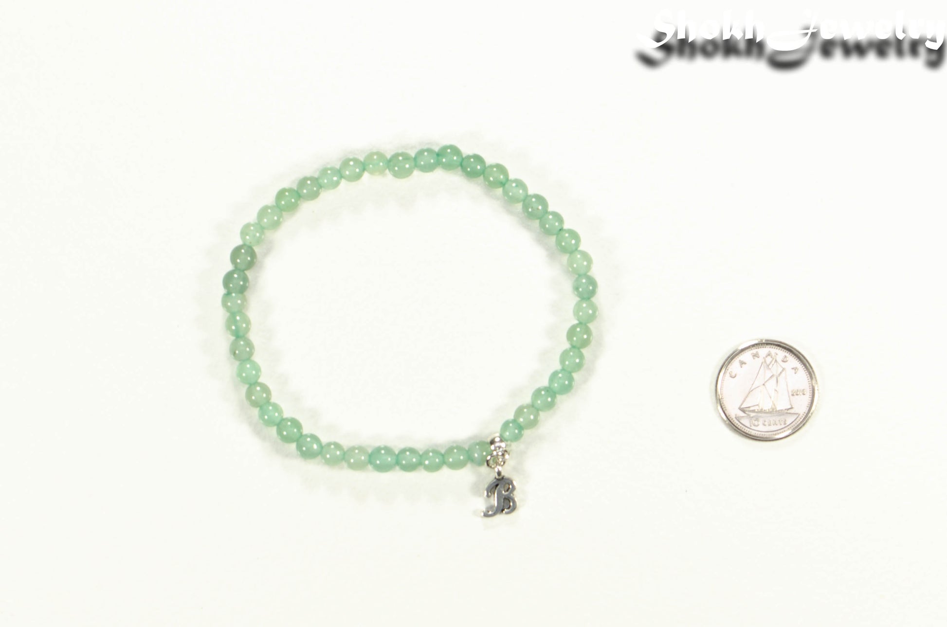 4mm Green Aventurine Bracelet with Initial beside a dime