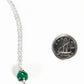 Close up of a Dainty Malachite Choker Necklace beside a dime