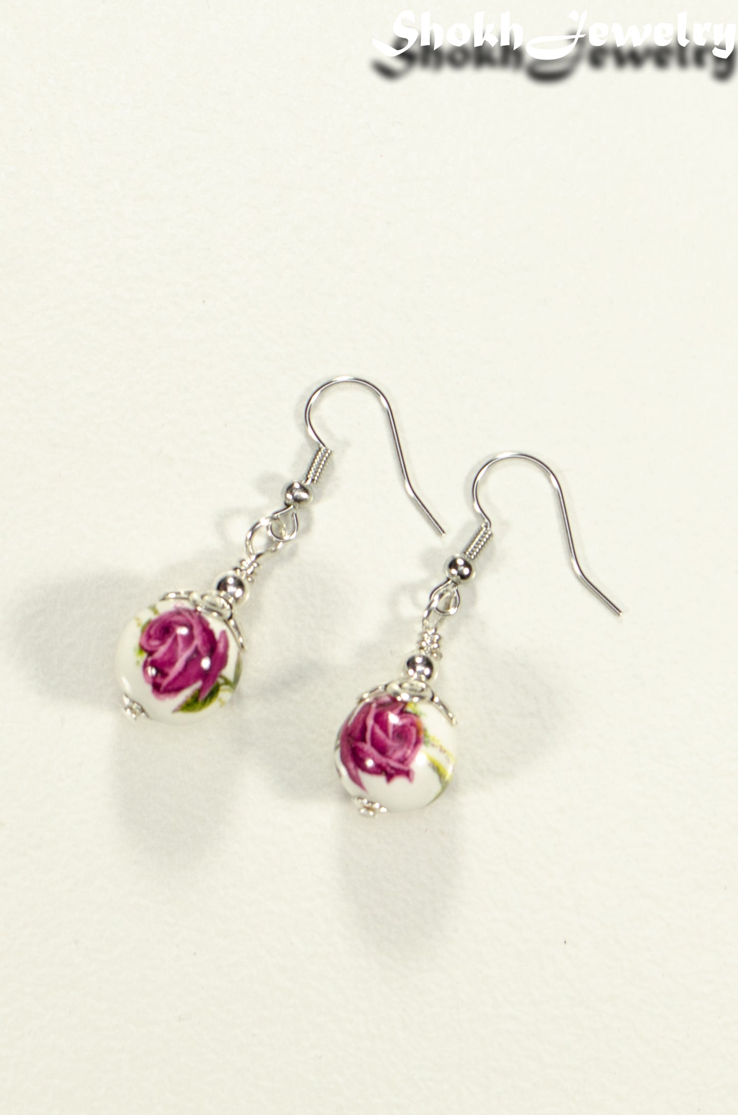 Top view of 12mm Ceramic Pink Flower Earrings