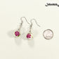 12mm Ceramic Pink Flower Earrings beside a dime.