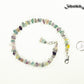 Natural Rainbow Fluorite Crystal Chip Choker Necklace beside a dime