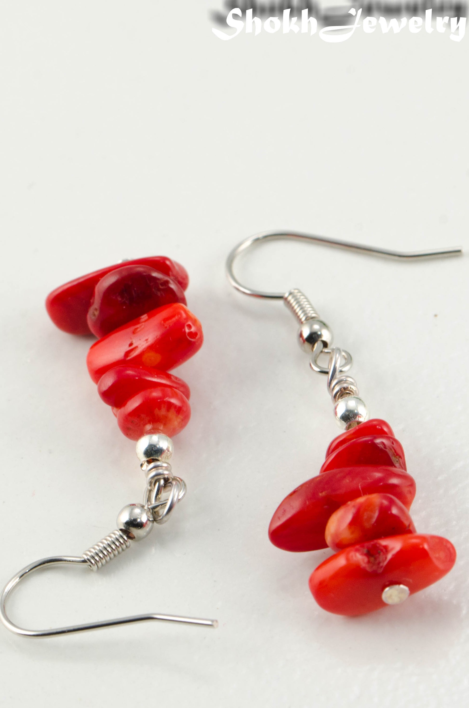 Close up of Simple Red Coral Chip Earrings.