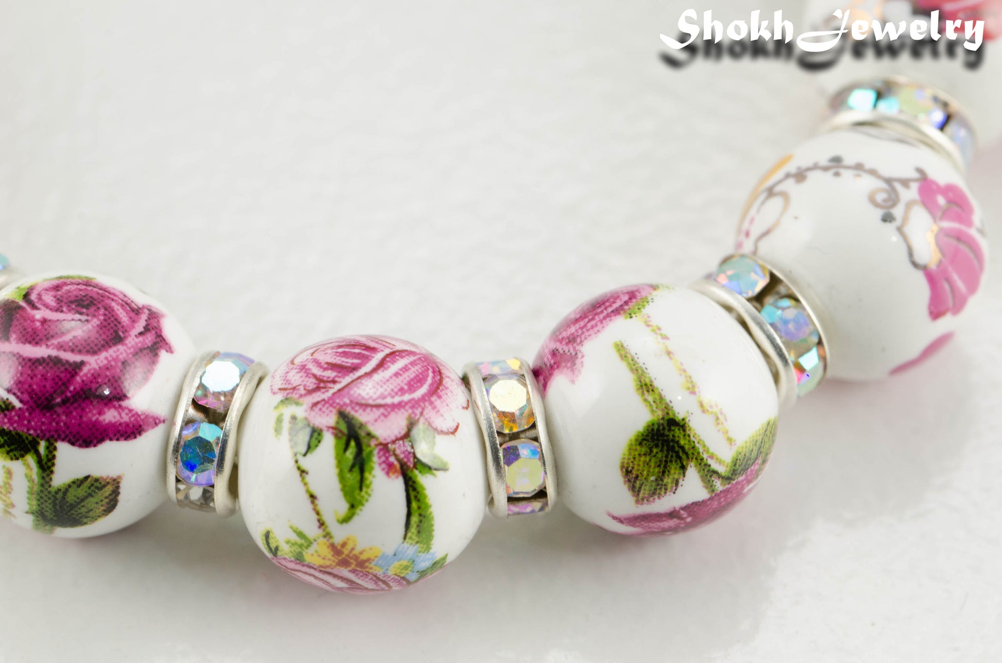 Close up of 12mm Ceramic Pink Flower Bracelet.