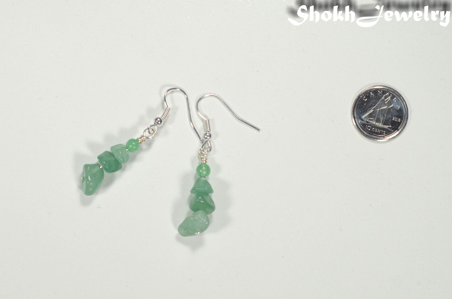 Simple Green Aventurine Crystal Chip Earrings beside a dime.