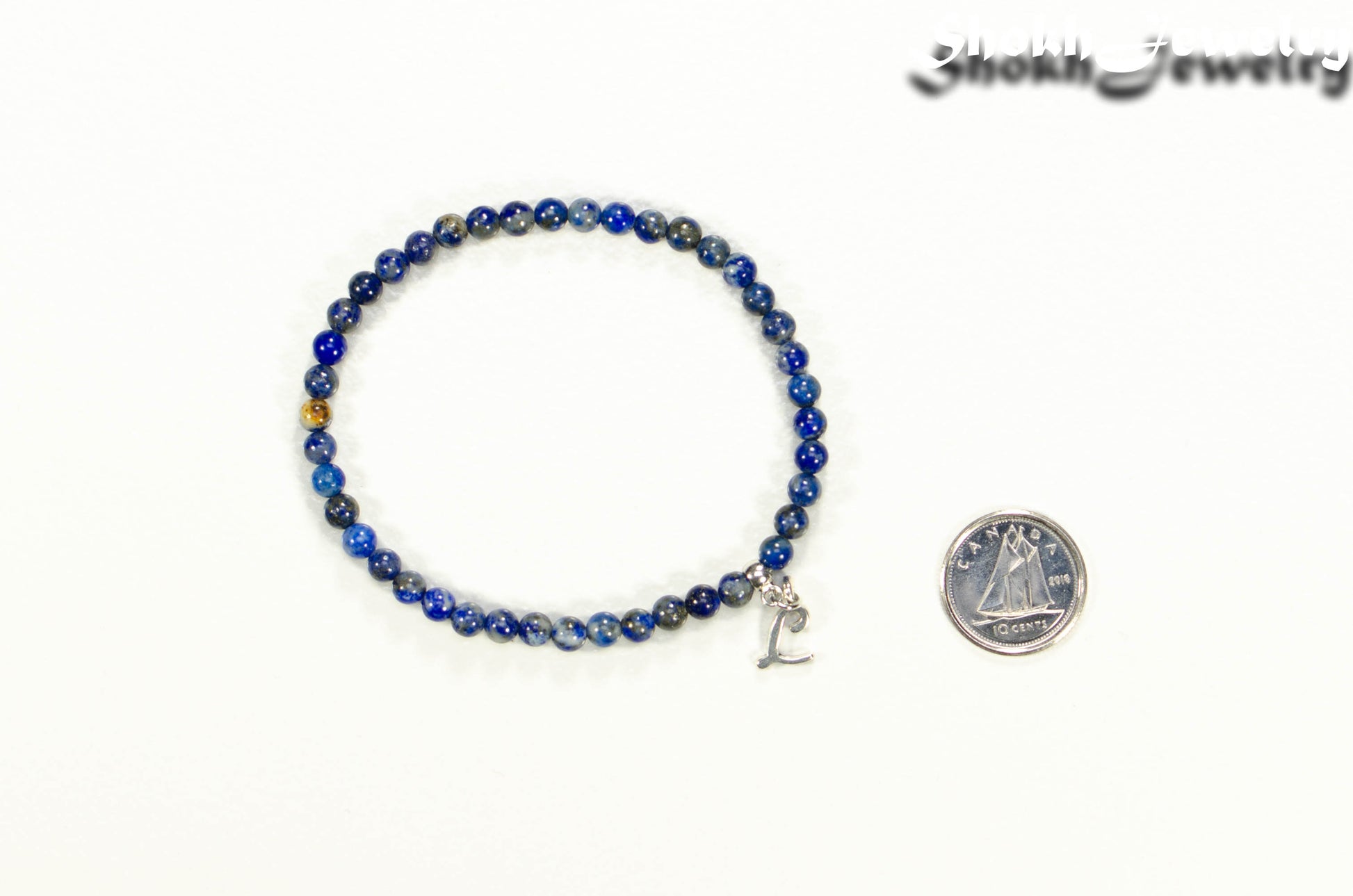 4mm Lapis Lazuli Bracelet with Initial beside a dime