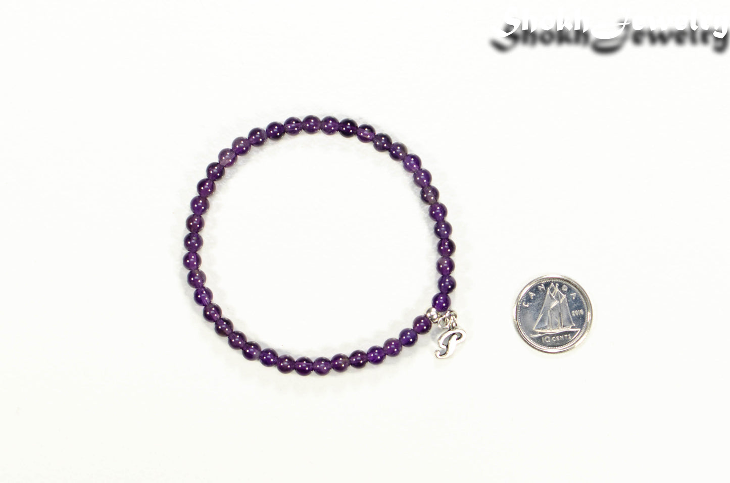 4mm Amethyst Bracelet with Initial beside a dime