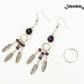 Statement Amethyst Crystal And Feather Earrings beside a dime.