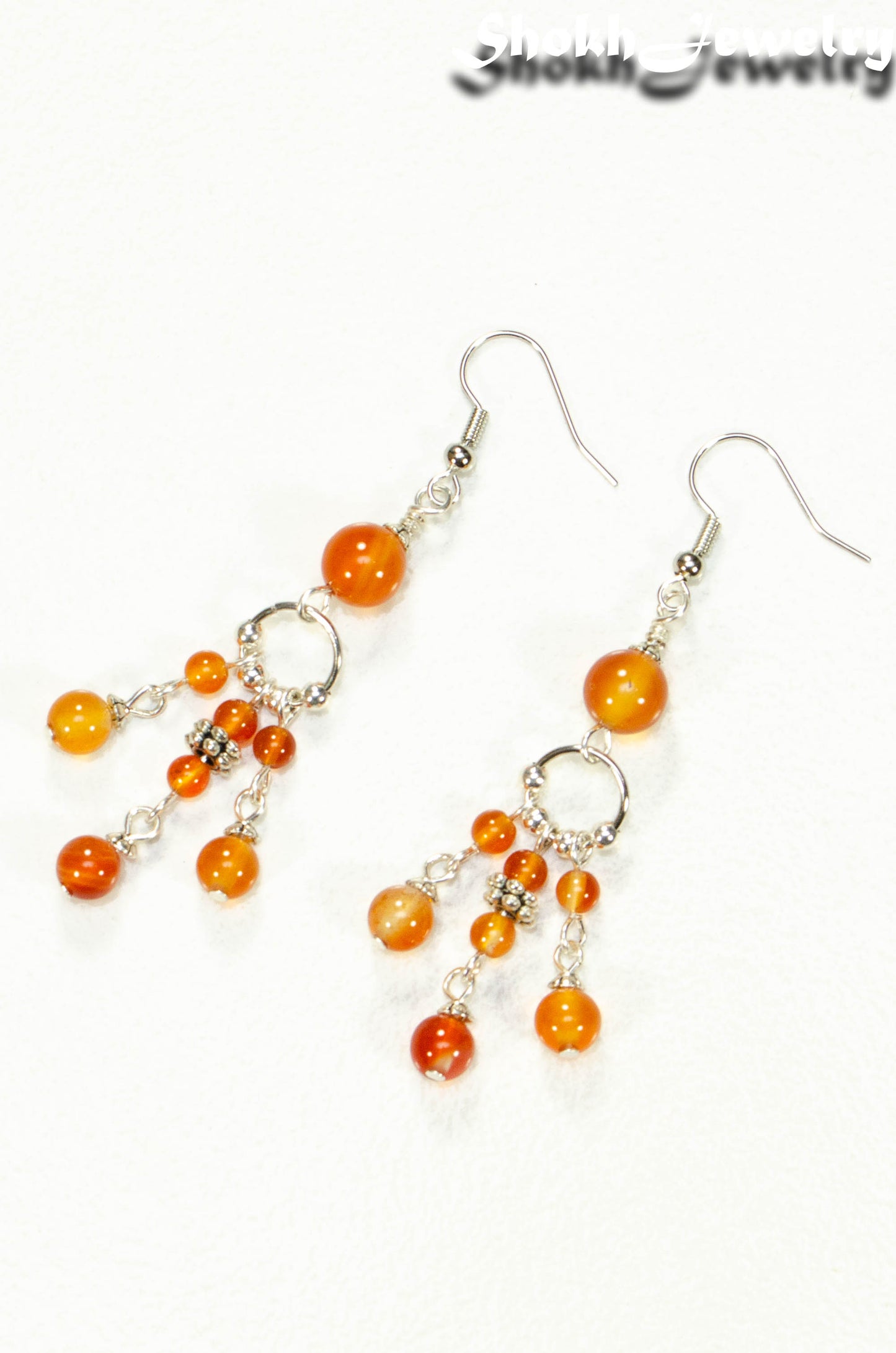 Top view of Statement Carnelian Crystal Chandelier Earrings.