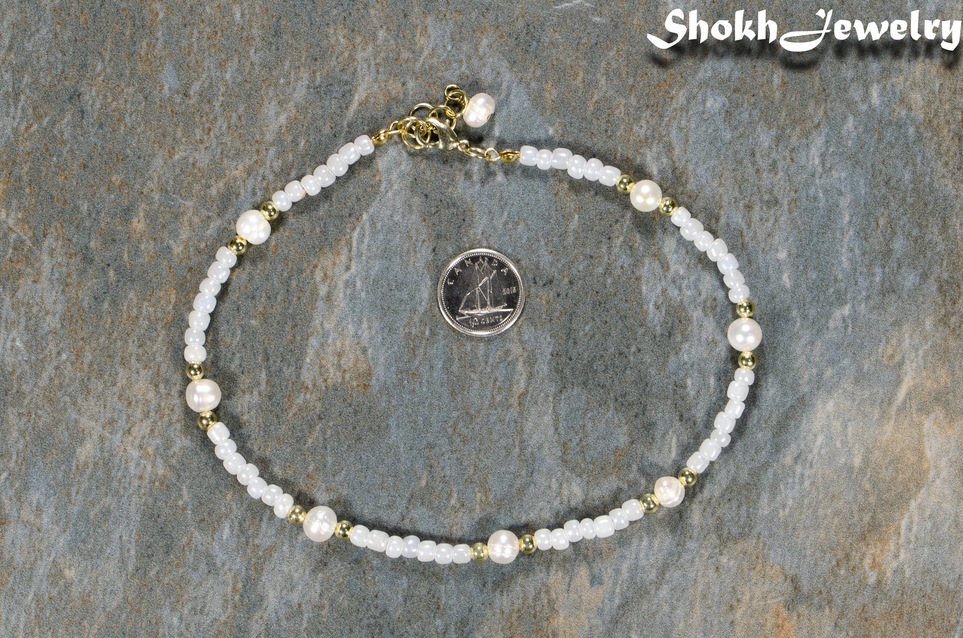 Freshwater Pearl and Seed Bead Anklet beside a dime