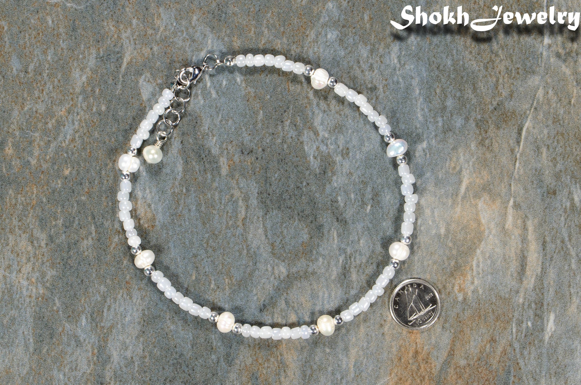 Freshwater Pearl and Seed Bead Anklet beside a dime