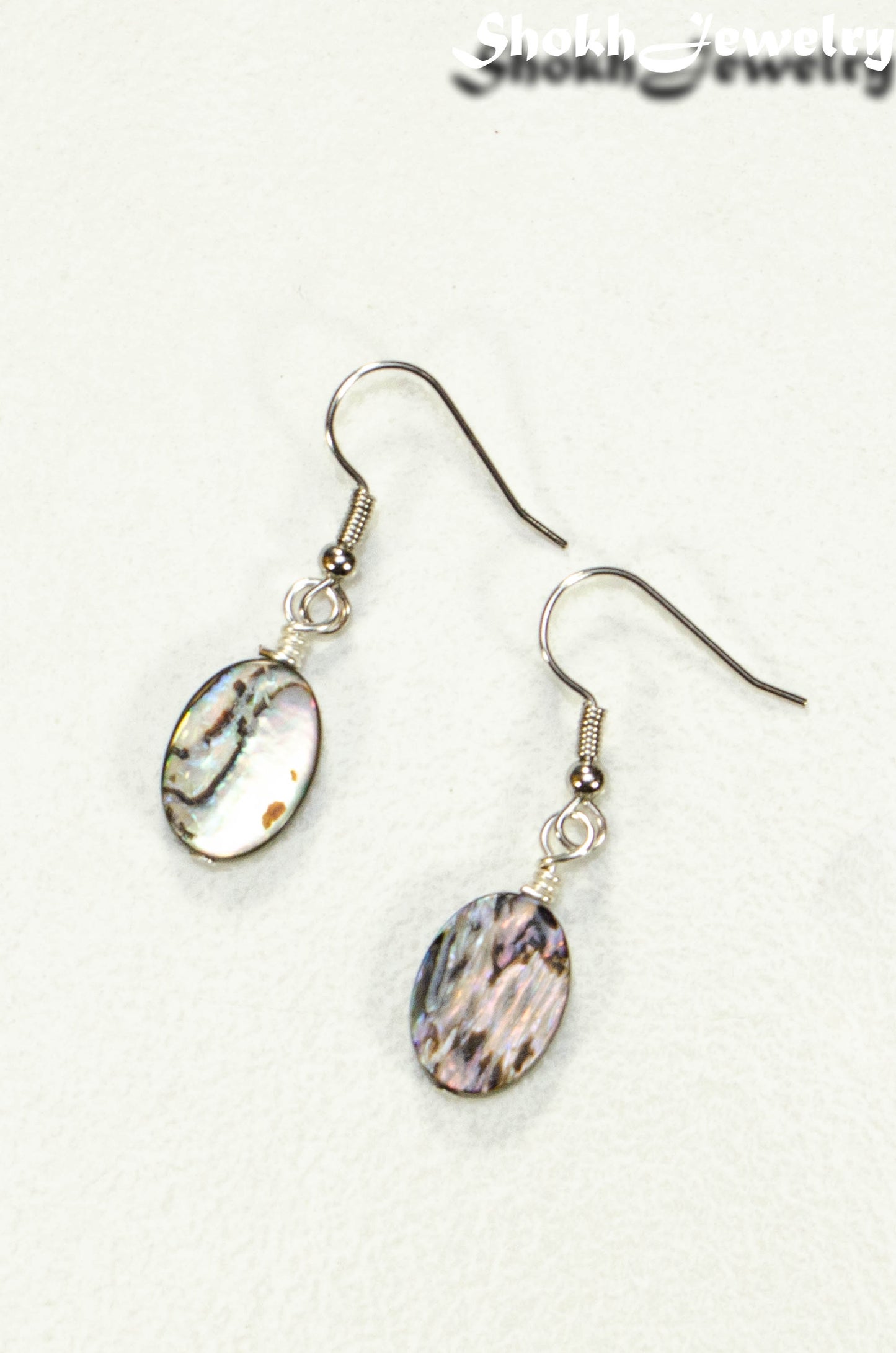 Top view of Simple Oval Abalone Shell Earrings.