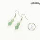 Small Green Aventurine Crystal Earrings beside a dime