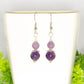 Small Natural Amethyst Crystal Earrings on a tea cup