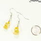 Simple Citrine Crystal Chip Earrings beside a dime.