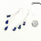Long Silver Plated Chain and Lapis Lazuli Chip Earrings beside a dime