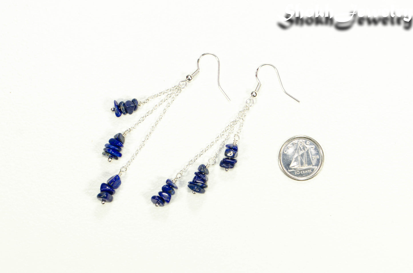 Long Silver Plated Chain and Lapis Lazuli Chip Earrings beside a dime
