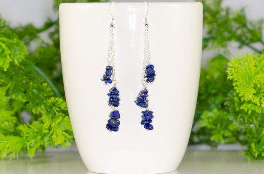 Long Silver Plated Chain and Lapis Lazuli Chip Earrings on a coffee mug