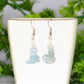 Simple Aquamarine Crystal Chip Earrings displayed on a tea cup.