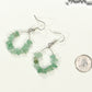 Natural Green Aventurine Crystal Chip Earrings beside a dime