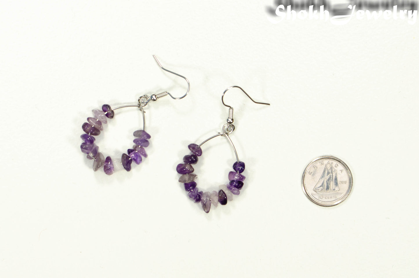 Natural Amethyst Crystal Chip Earrings beside a dime