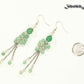Long Stainless Steel Chain and Green Aventurine Earrings beside a dime.