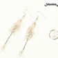 Long Stainless Steel Chain and Rose Quartz Earrings beside a dime.