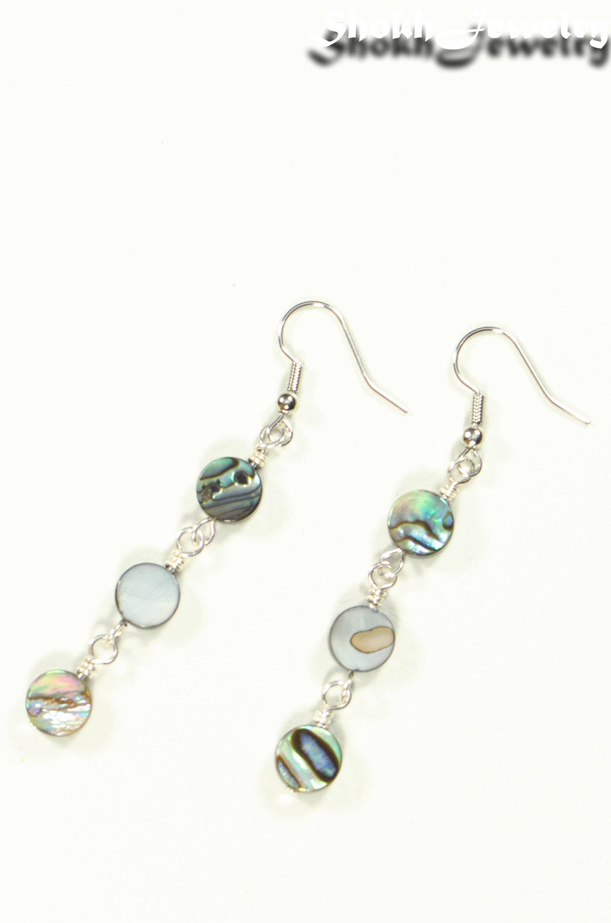 Top view of Long Natural Abalone Shell Earrings.