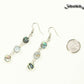 Long Natural Abalone Shell Earrings beside a dime.