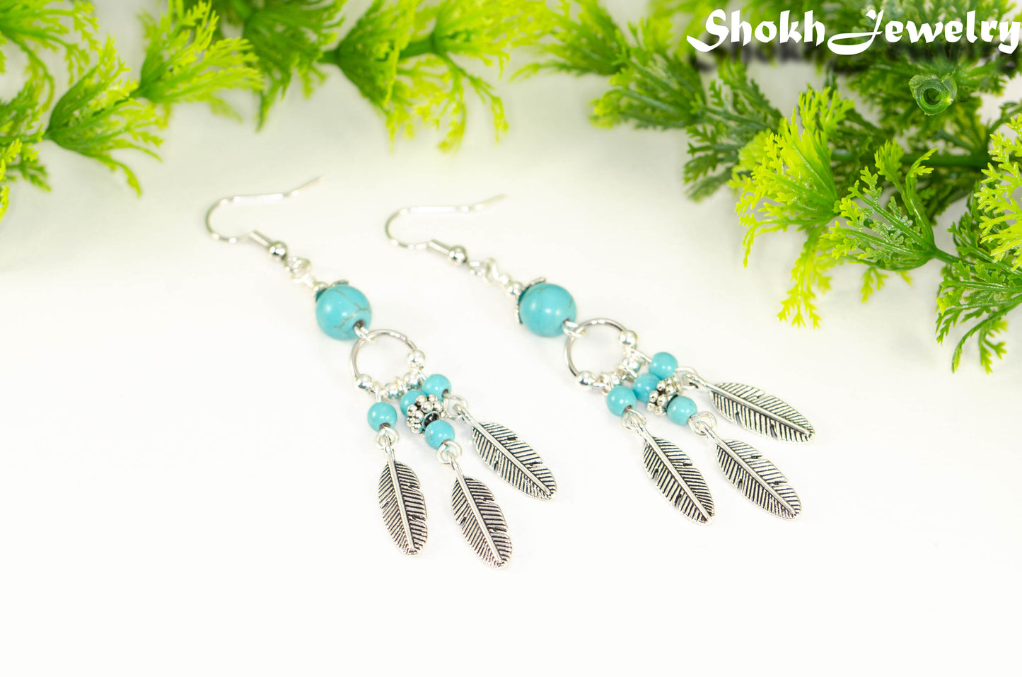 Statement Turquoise Howlite And Feather Earrings.