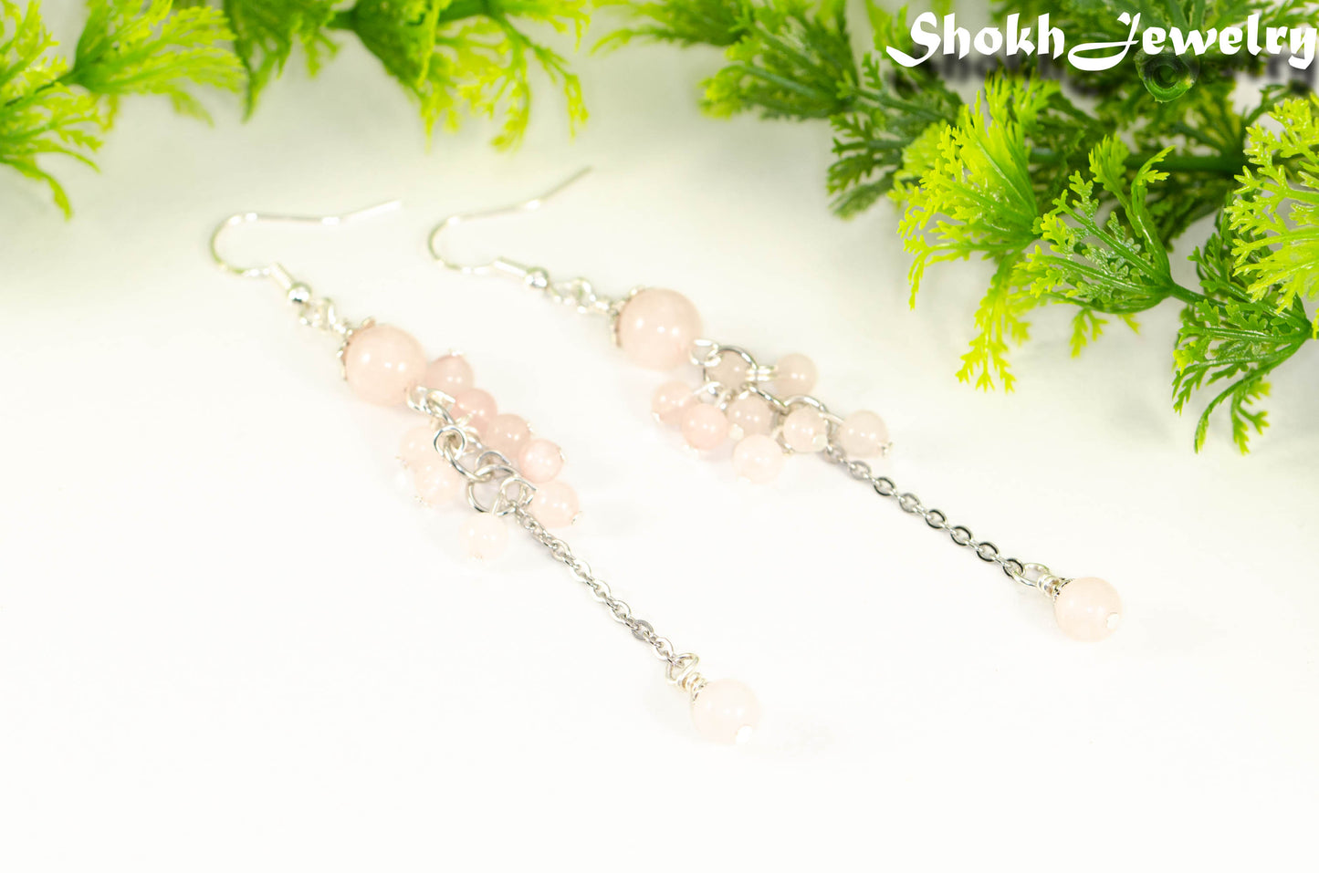 Close up of Long Stainless Steel Chain and Rose Quartz Earrings.