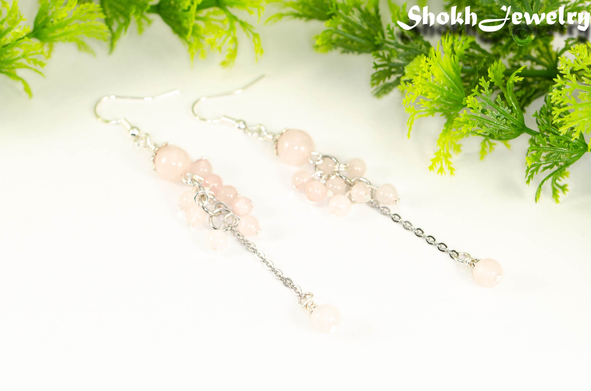 Close up of Long Stainless Steel Chain and Rose Quartz Earrings.