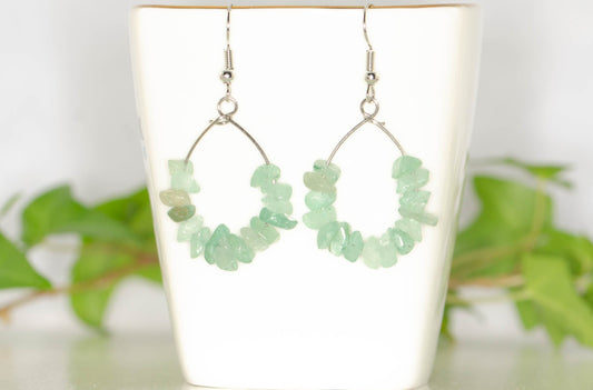 Natural Green Aventurine Crystal Chip Earrings on a tea cup