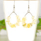 Natural Citrine Crystal Chip Earrings on a tea cup